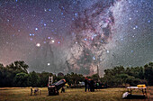 Scorpius rising over a telescope and observers at the annual OzSky Star Party in Coonabarabran, NSW, Australia on April 5, 2016. Mars is the bright reddish object outshining Antares and to the left of Antares. Saturn is below Mars above the trees.