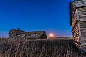 The rising Hunter’s Full Moon on October 27, 2015, at the old barn near home in southern Alberta. This is one frame from a time-lapse sequence, with a 3-second exposure at f/5.6 and ISO 3200 with the Nikon D750 and Sigma 24mm.
