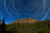 Circumpolar stars trails over Castle Mountain in Banff, Alberta. Taken July 23, 2010 from Castle Cliffs viewpoint on Bow Valley Parkway. A stack of 160 25-second exposures with Canon 15mm lens at f/4 and Canon 7D camera at ISO 640. Taken over 2 hours. Full Moon light provided the illumination.