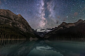 The summer Milky Way to the southwest over Victoria Glacier and Lake Louise in Banff National Park, Alberta on a moonless night, August 29, 2016. The bright star at top is Altair, with the stars of Aquila being the main constellation here, with the Scutum starcloud just over the glacier and the stars of Ophiuchus to the right. The Serpens-Ophiuchus Double Cluster is prominent here just to the right of the Milky Way.