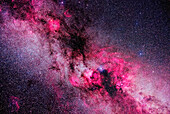 This is a framing of the rich complex of nebulosity in and around the constellations of northern Cygnus and southern Cepheus, in a blend of "white light" images and images shot through a deep red hydrogen-alpha filter that isolates the red emission line from the gas clouds, bringing them out in much more detail than is otherwise possible.