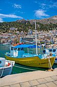 View of harbour boats in Kalimnos with hills in the background, Kalimnos, Dodecanese Islands, Greek Islands, Greece, Europe