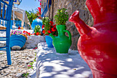View of colourful jugs and furniture in local Taverna, Kos Town, Kos, Dodecanese, Greek Islands, Greece, Europe