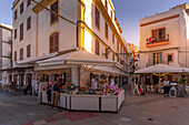 View of restaurants in Ibiza Town with Cathedral in background, Ibiza Town, Ibiza, Balearic Islands, Spain, Mediterranean, Europe