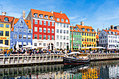 Nyhavn harbour with colourful houses reflected in the waters channel, daytime, Copenhagen, Denmark, Scandinavia, Europe