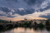 Prague Castle and Manes Bridge at dusk, Prague, Bohemia, Czech Republic (Czechia), Europe