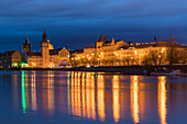 Reflection of Bedrich Smetana Museum and Old Town Waterworks at Smetanovo nabrezi at night, Prague, Bohemia, Czech Republic (Czechia), Europe