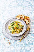 Fruity fennel salad with oranges, mint, olives and pita bread (vegan)
