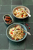 Millet porridge with dates, apple and pomegranate (vegan)