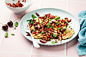 Grilled halloumi cheese with cherry salsa