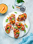 Melon bruschetta with Parma ham