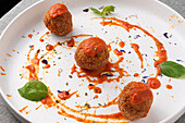 Fried meatballs with tomato sauce