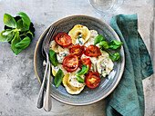 Stuffed pasta with tomatoes, basil, and cream