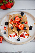 Buckwheat crepes with cream and berries
