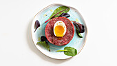 Soft-boiled egg on beef tartare