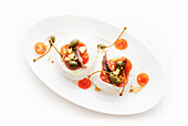 Mozzarella stuffed with anchovies, cherry tomatoes and capers