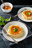 Spaghetti with tomato sauce and basil