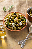 Marinated olives with feta and rosemary