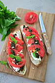 Sandwiches with homemade bread, cheese, tomatoes and pesto