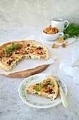 Quiche with chanterelles and onions in sour cream filling with cheese