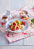 Sweet strawberry dumplings with hazelnut crumb