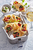 Puff pastry parcels with ham, cheese and vegetables