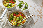 Spring soup with ribbon noodles and vegetables
