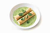 Ricotta and mint cannelloni on broad bean pesto