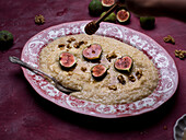 Porridge with roasted figs, walnuts, and honey
