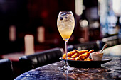 Champagne cocktail and deep-fried prawns