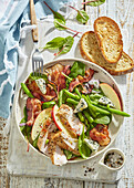 Summer salad with turkey breast, beans and apple