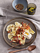 Cheese ravioli with bacon and nuts