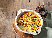 Baked mashed potatoes with smoked meat and broccoli