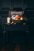 Still life with autumn fruits in a black ambience