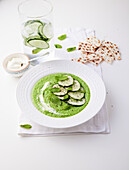 Green soup with cucumber, avocado, sour cream, and mint