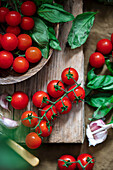 Fresh cherry tomatoes and basil leaves