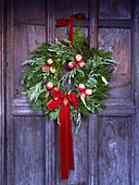 Christmas door wreath on a wooden door