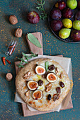 Pizza with figs, fior di latte mozzarella, olives, and walnuts