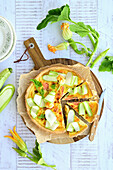 Tarte with salmon and zucchini flowers