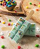 Creamy m&m ice cream on a stick
