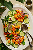 Mexican papaya salad with cucumber and red onions