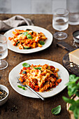 Pasta casserole with cheese, tomato sauce, zucchini, red pepper and carrots