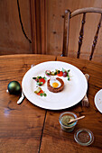 Beef tartare with quail egg and vegetable garnish