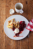 Kaiserschmarrn with pickled plums and cream