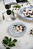 Mini pavlova with cherries and chocolate shavings