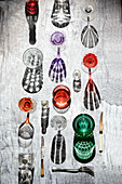 Various drinking glasses with alcoholic drinks casting shadows