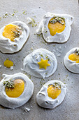Sunny side up - meringue with lemon curd and grated pumpkin seeds