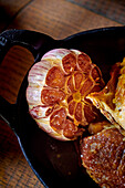 Poulet jaune des Landes (French roast chicken from the Landes region), roasted garlic bulb