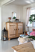 Wooden cabinet in bright country-style living room