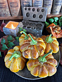 Stuffed mini pumpkin pies made from yeast dough for Halloween